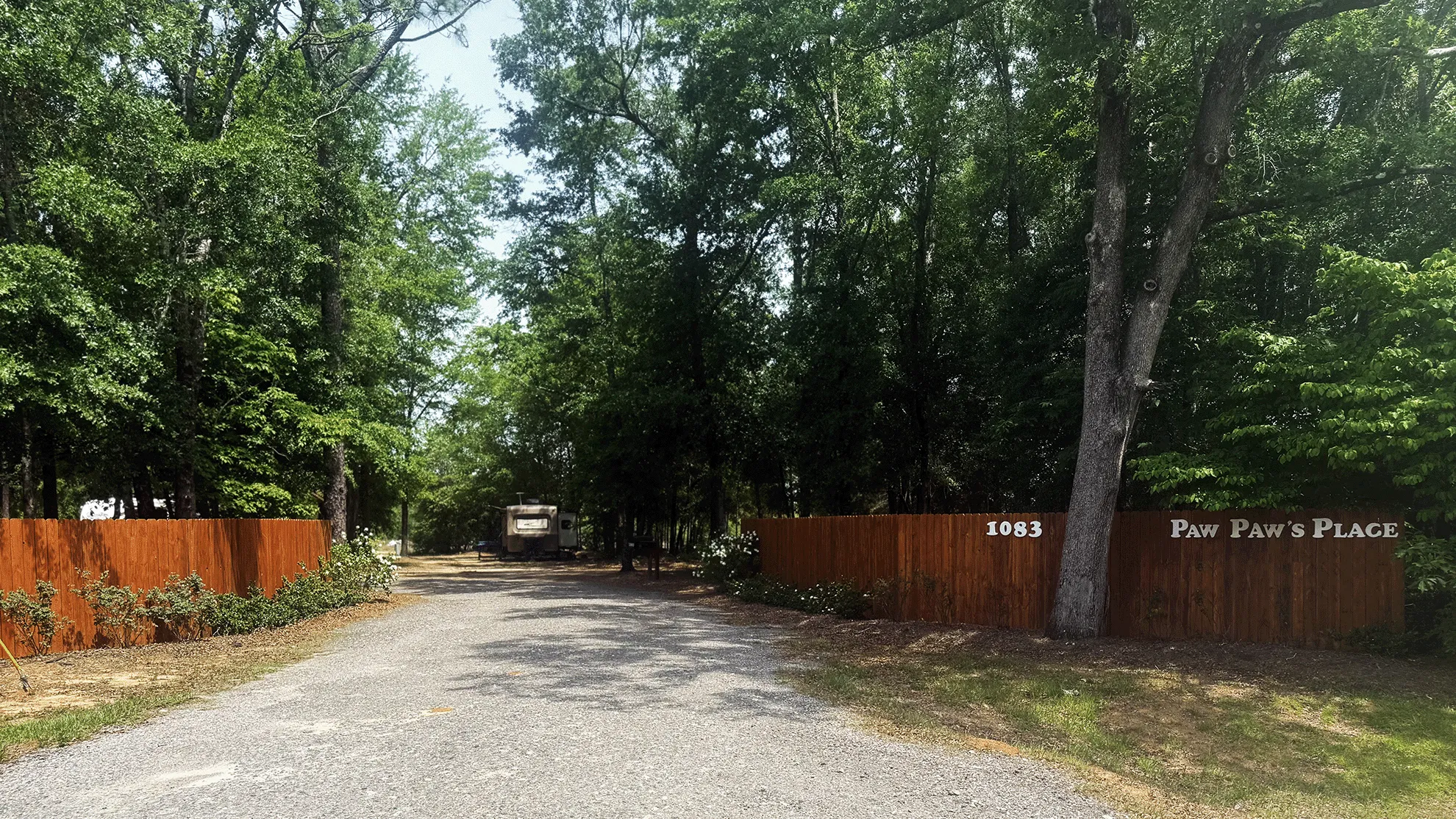 Wide view of Paw Paw's RV Park with asphalt roads and shade trees